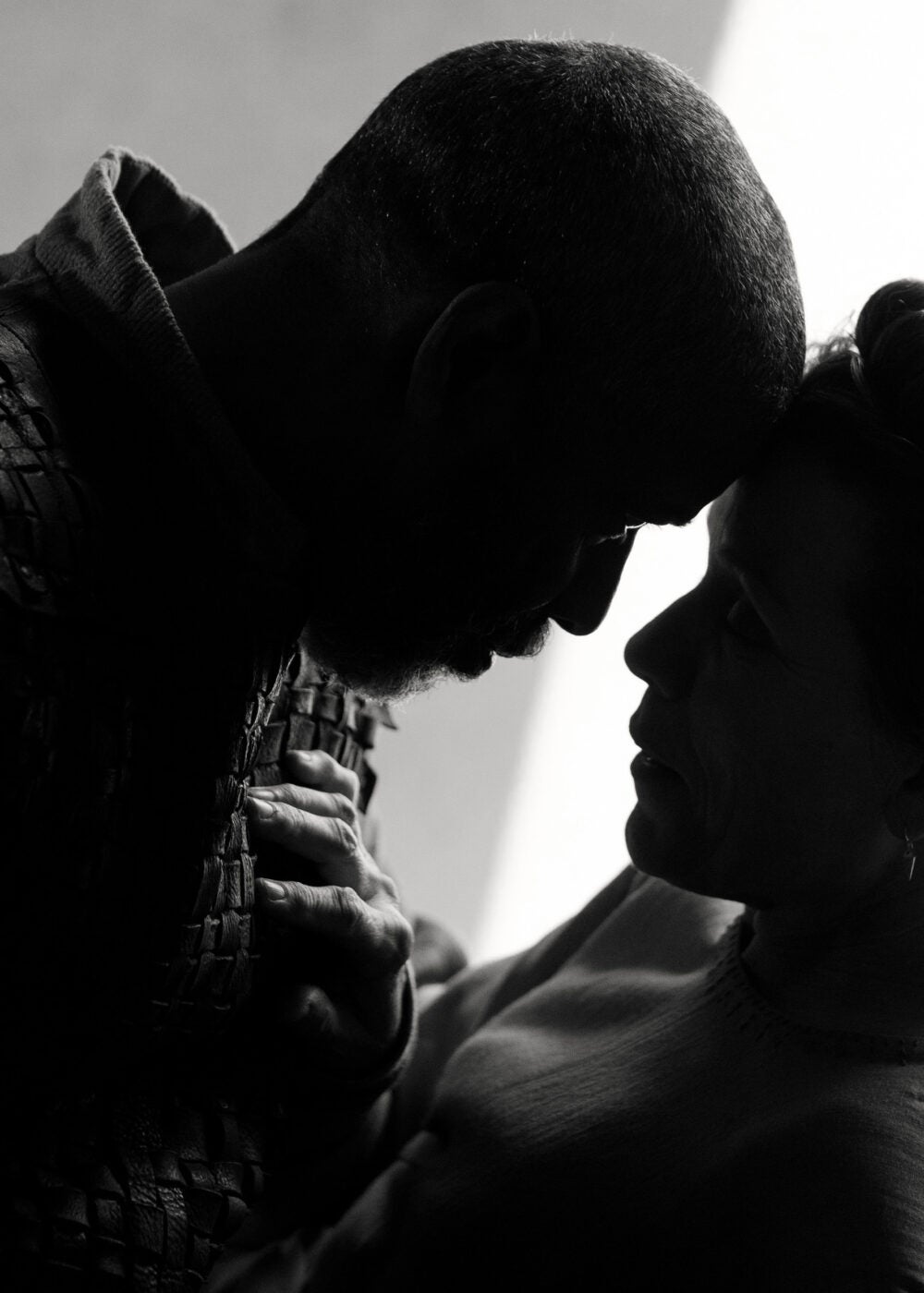 Silhouettes of Denzel Washington and Frances McDormand in “The Tragedy of Macbeth.”