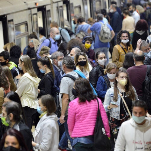People in a crowd wearing masks.