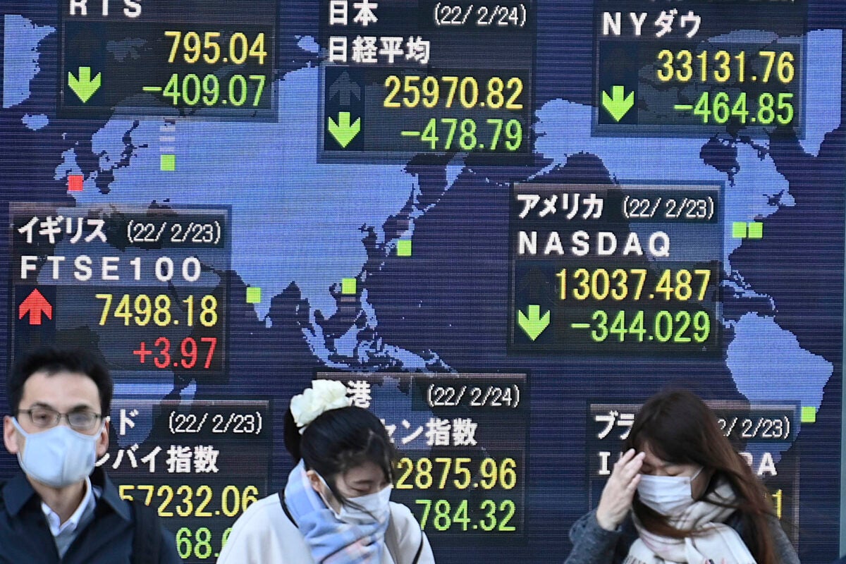 Electric board in Tokyo shows world stock prices.