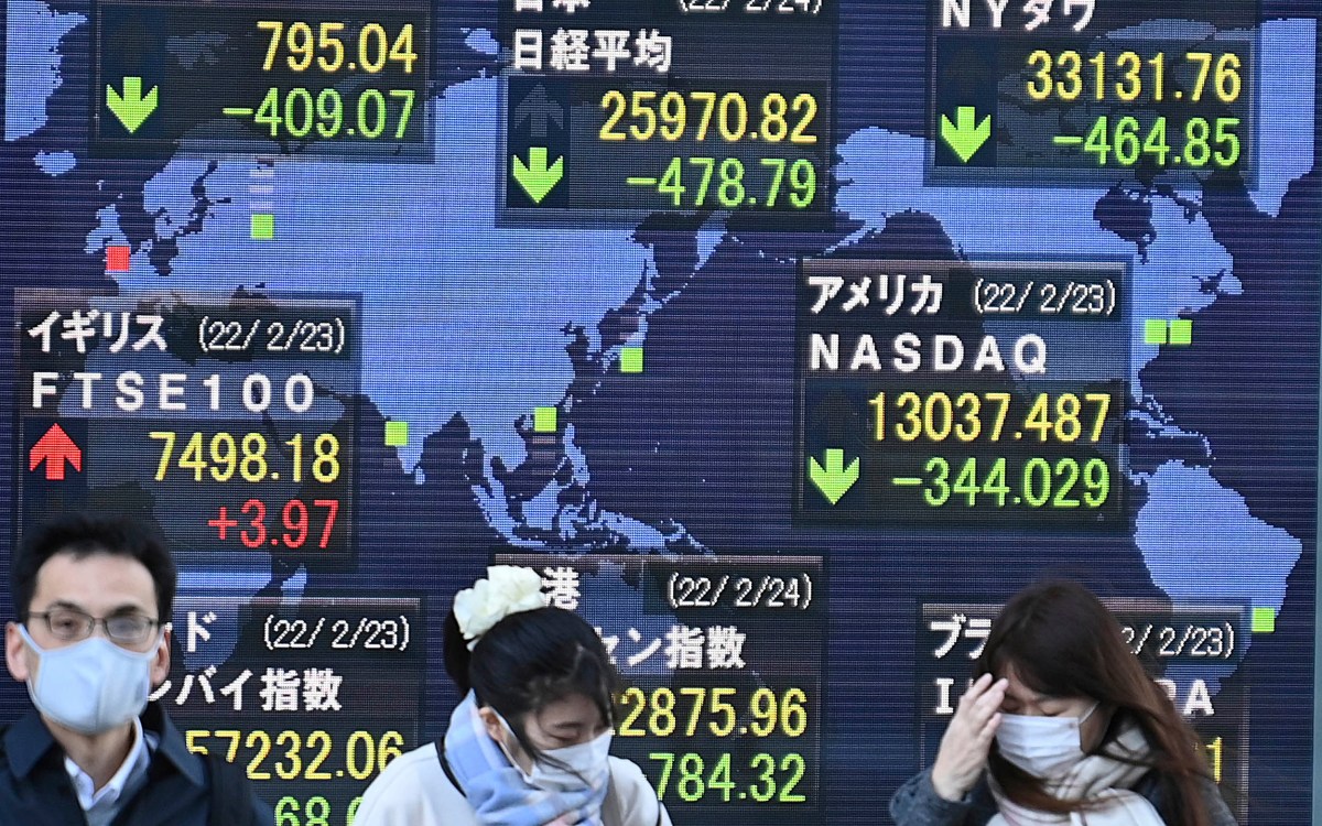 Electric board in Tokyo shows world stock prices.