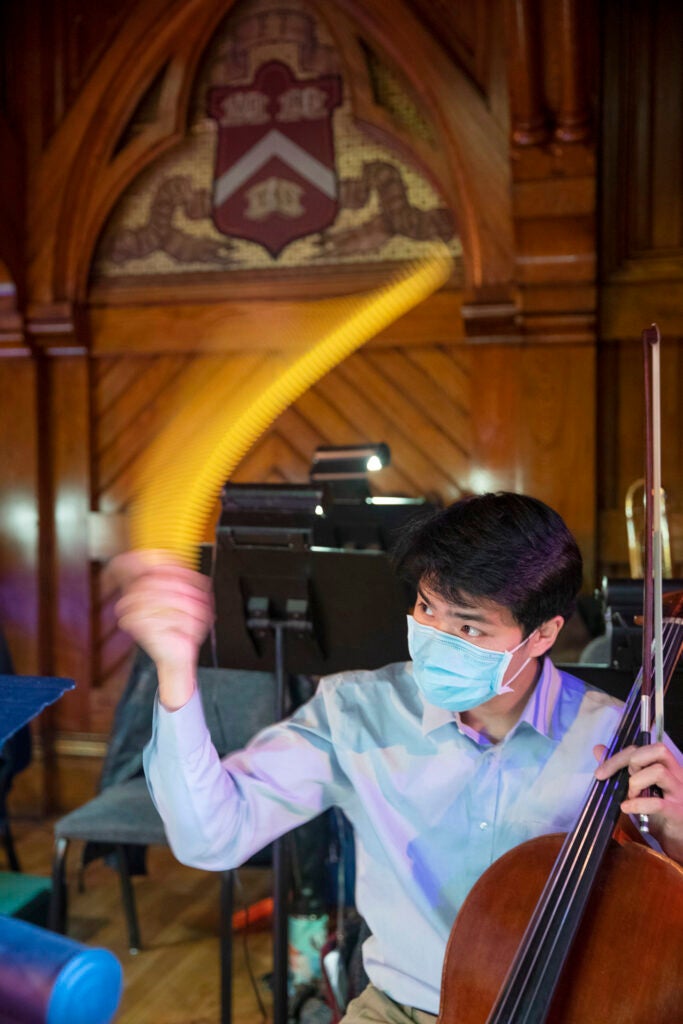 Nathan Le ’22, who performs as first cellist and whirly tube expert.