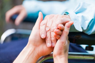 Hands of young and elderly.