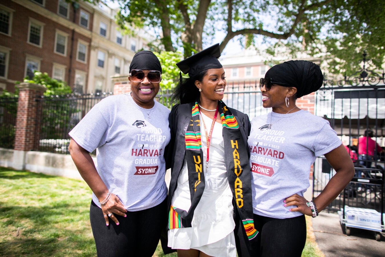 Sidney Cobb ’22 (center), of Winthrop House, is pictured with her childhood teachers Aprile (left) and Deanna Thomas.