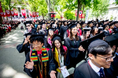 Harvard graduates celebrate Commencement 2022 in Tercentenary Theatre.