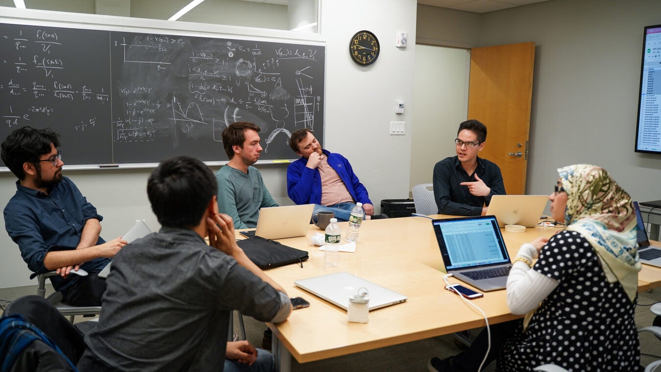 Members of Harvard's Black Hole initiative meet to discuss black hole images.