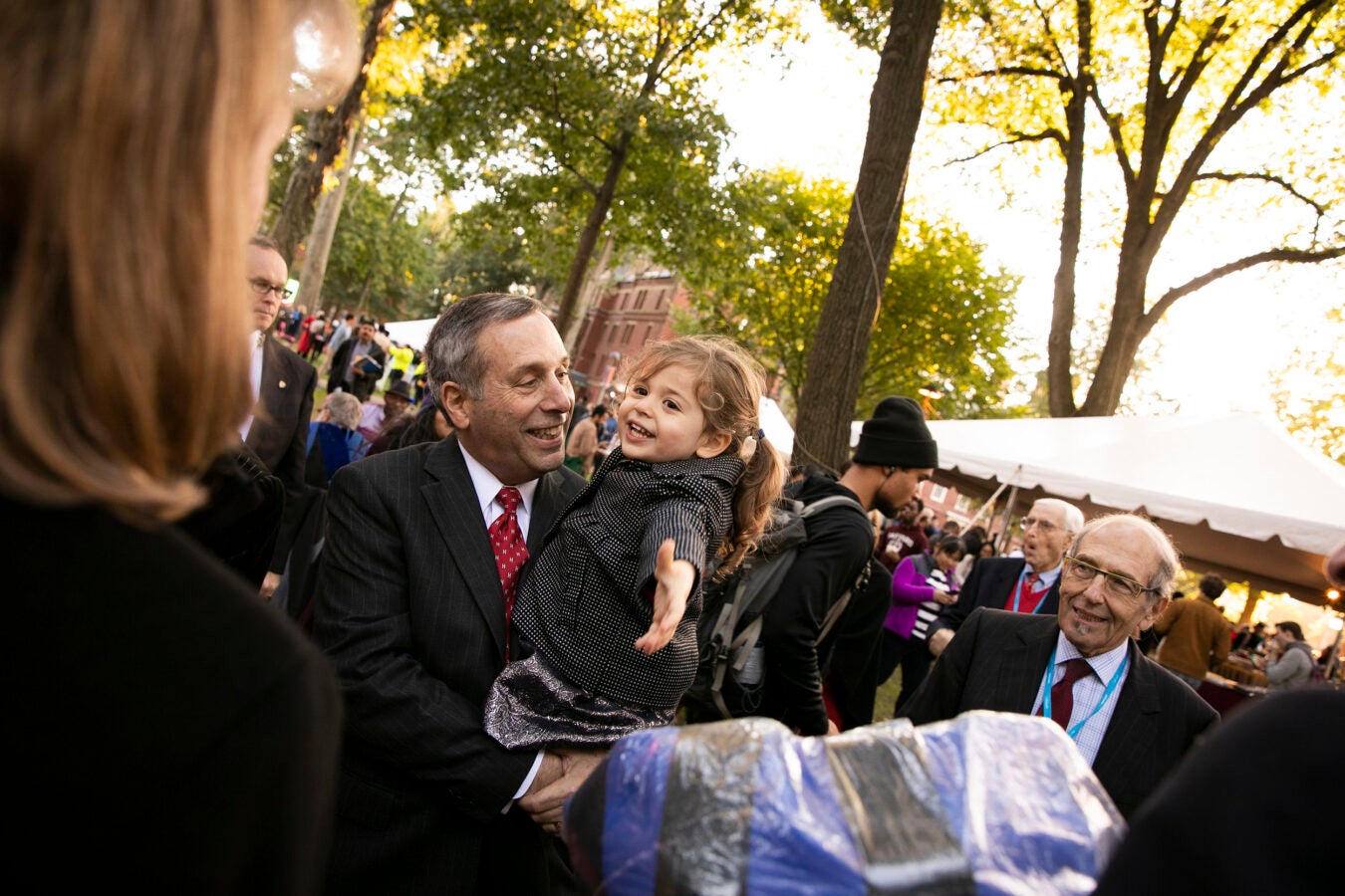 Larry Bacow with granddaughter at his inauguration as Harvard president.