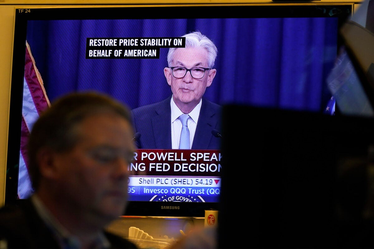 Jerome Powell seen on a TV at NY Stock Exchange.