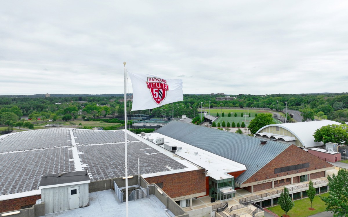 Harvard flag flying over stadium