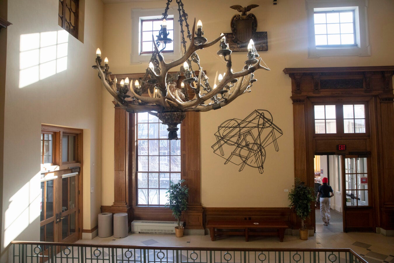 A chandelier hangs in the Barker Center lobby.