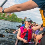 Benika Pinch paddles during Harvard Dragon Boat practice on the Charles River.