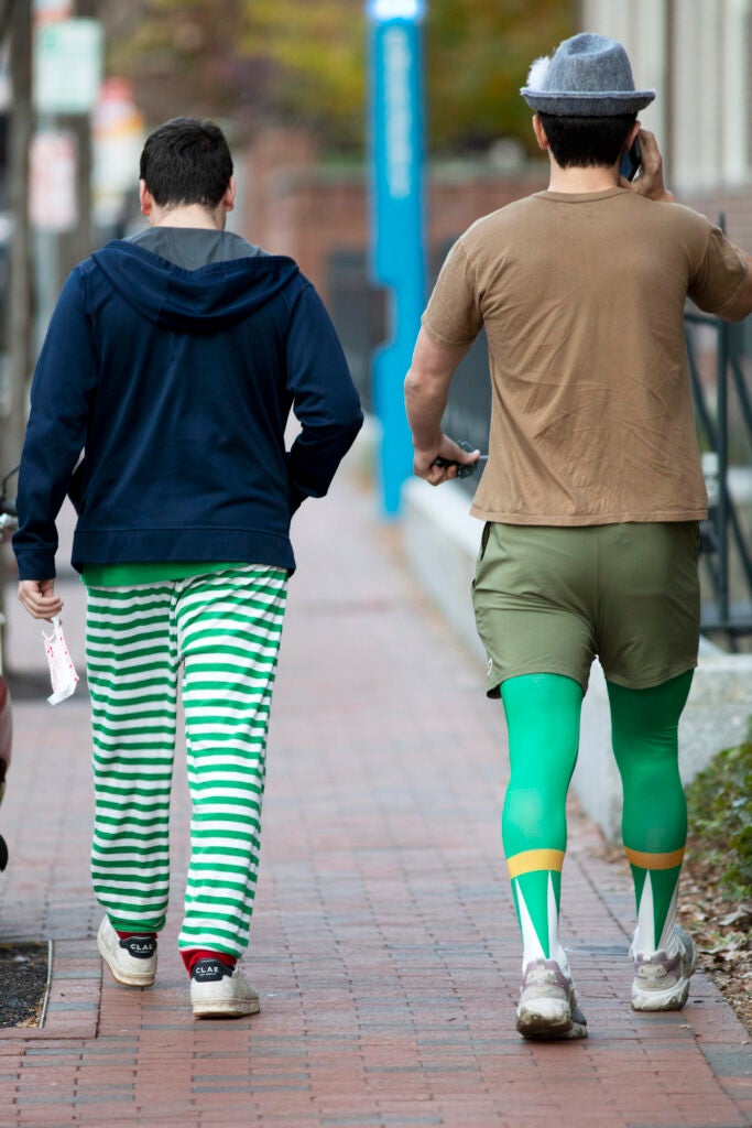 Two men wearing green stockings.