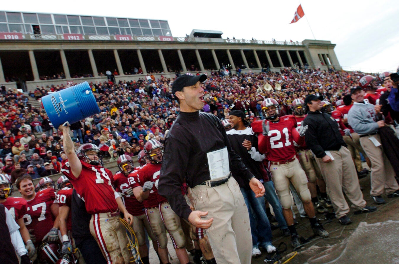 Tim Murphy reacts to getting water dumped on him after victory over Yale at Harvard Stadium in 2004.