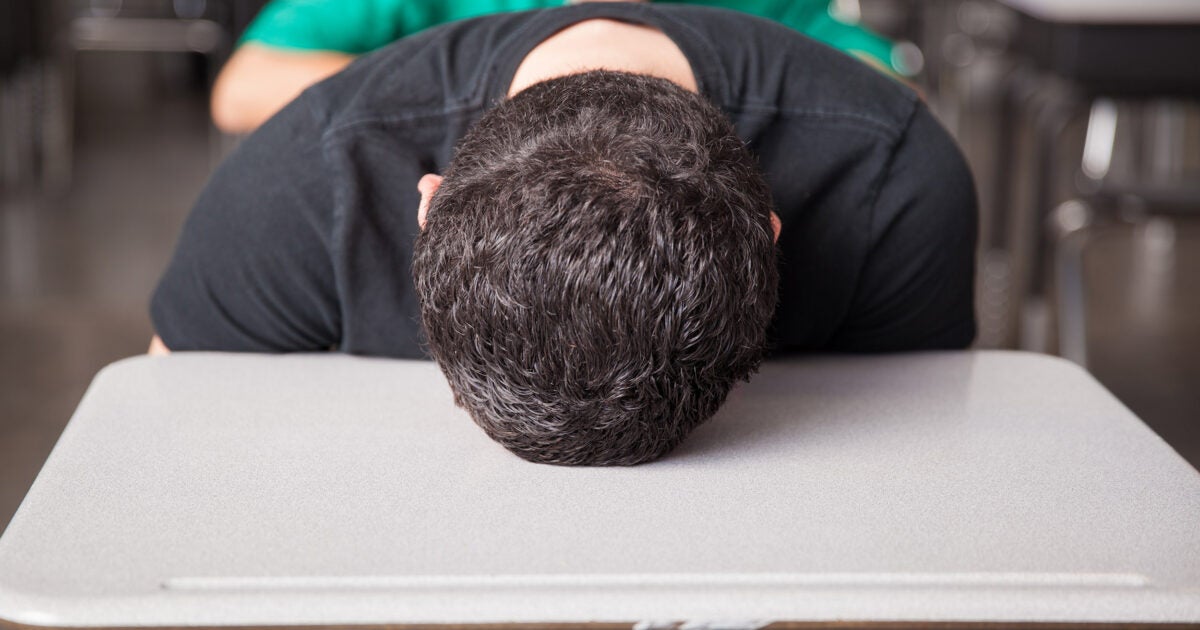 High school student asleep on desk.