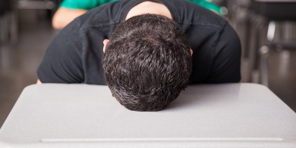 High school student asleep on desk.