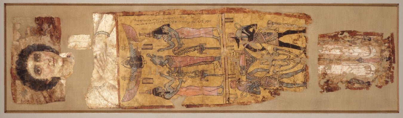 Burial shroud of Tasheret-Horudja from Roman Egypt features naturalistic portrait of face and feet combined with traditional Egyptian imagery.