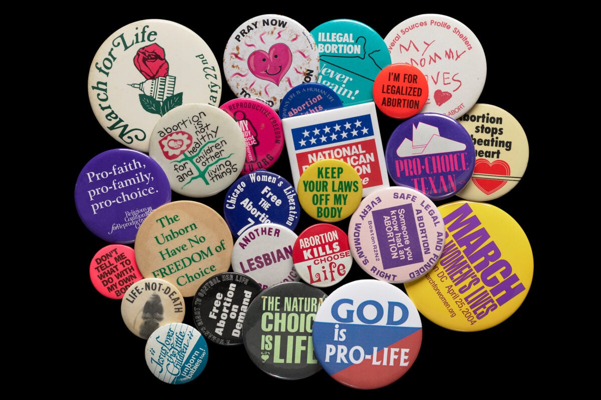 Political buttons expressing opinions on abortion rights.
