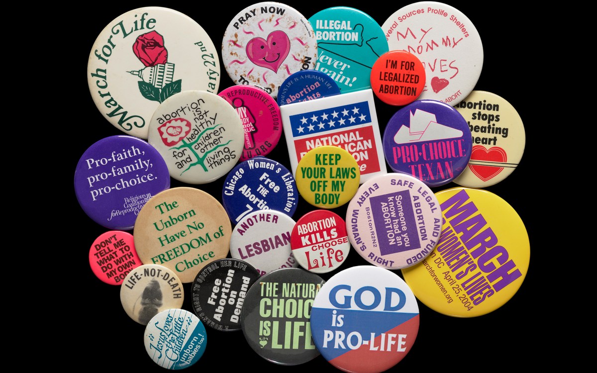 Political buttons expressing opinions on abortion rights.