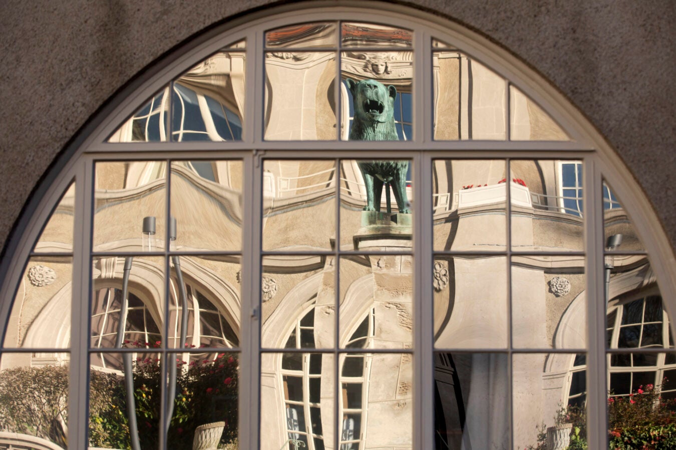 Mirrored windows are pictured in the Adolphus Busch Hall courtyard.