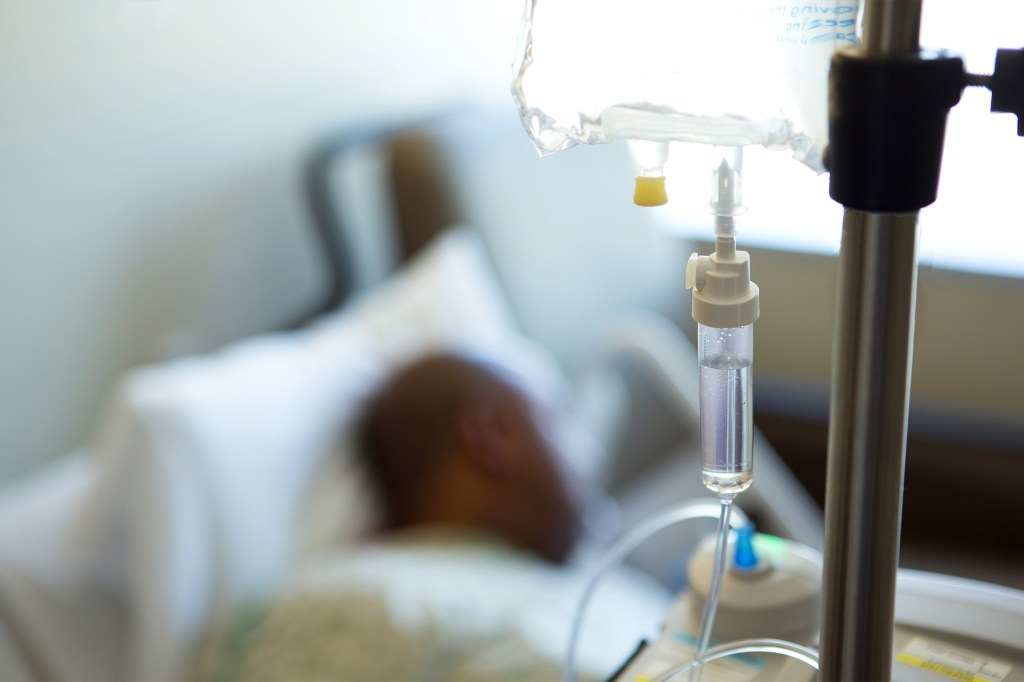 Black man in a hospital bed