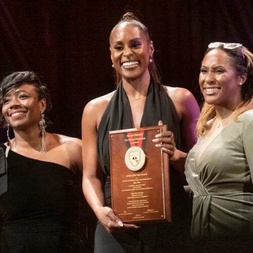 2023 Artist of the Year Issa Rae holds her award, flanked by Alta Mauro and Sade Abraham.