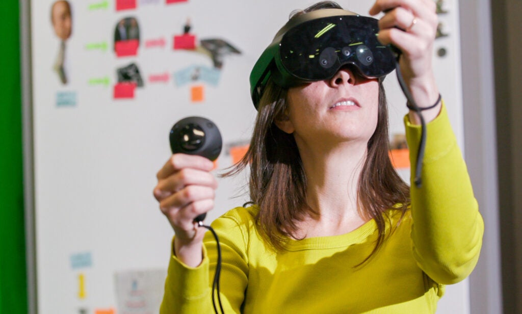 Christine D'Auria wearing VR headset.