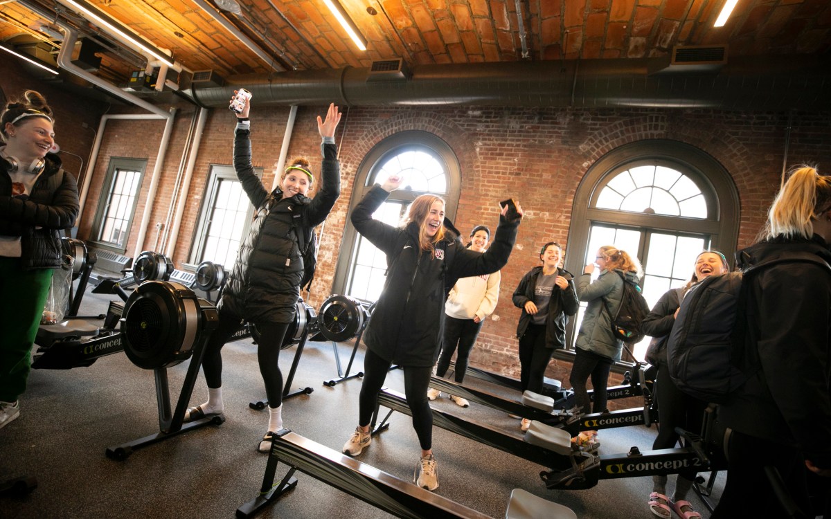 Members of rowing team dance in newly renovated Weld Boathouse.