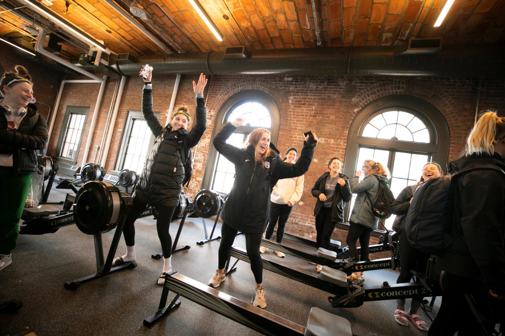 Members of rowing team dance in newly renovated Weld Boathouse.