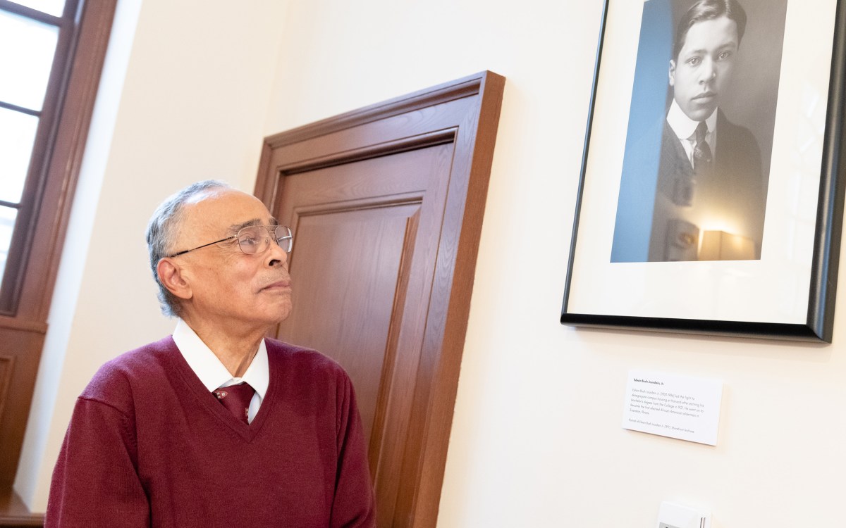 Spencer Jourdain looks up at portrait of father Edwin Bush Jourdain Jr.