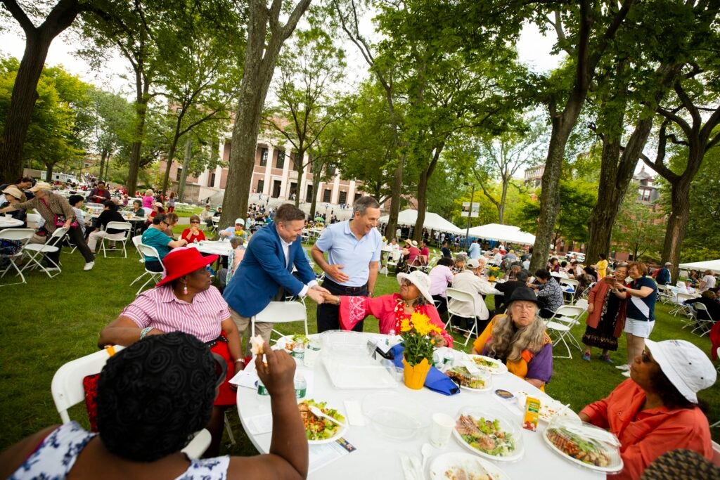 At the annual Cambridge Senior Luncheon, Bacow and senior citizens met for an afternoon of dining, dancing, and socializing in the Yard.