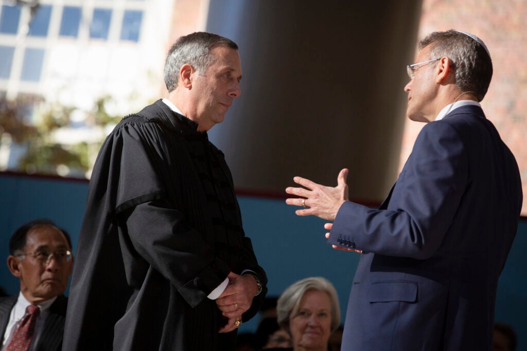 Bacow listens to friend and rabbi Wesley Gardenswartz (right) deliver the benediction at his inauguration.