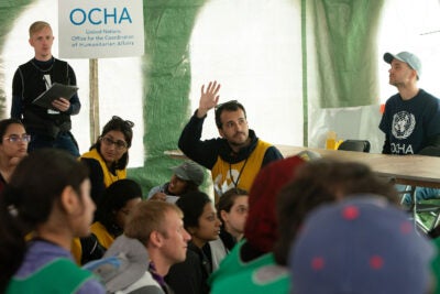 Students during a simulated UNOCHA meeting.