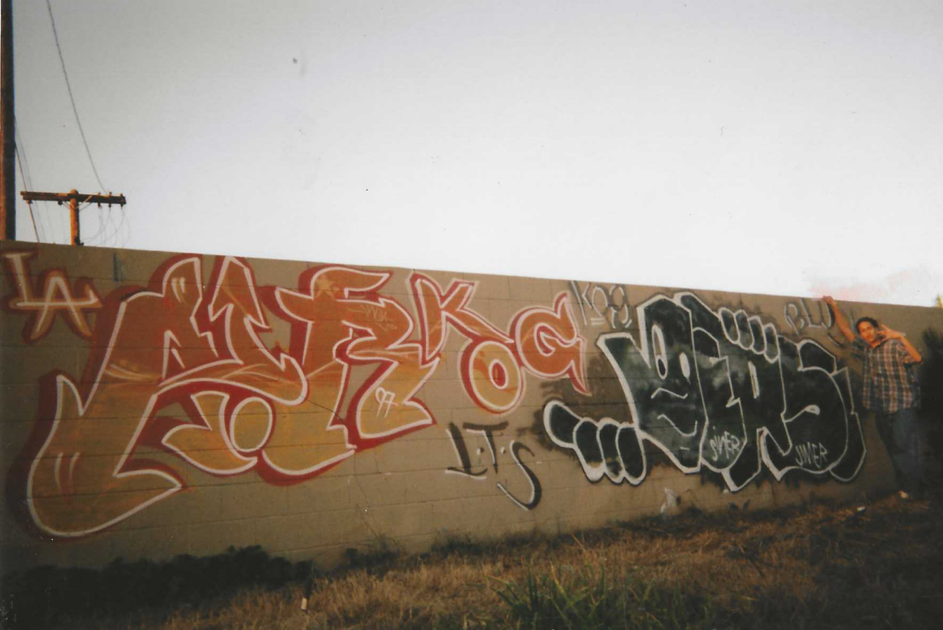 James Riley in front of a wall of graffiti in L.A. in 1997.