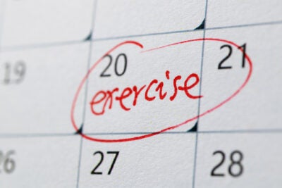 Calendar marked with reminder to exercise.