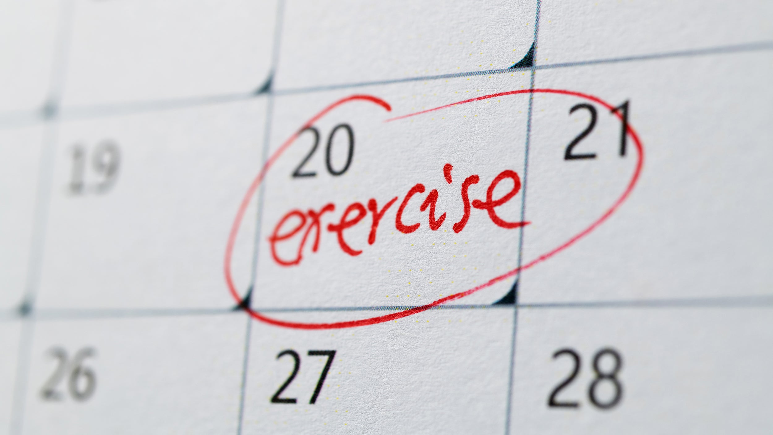 Calendar marked with reminder to exercise.
