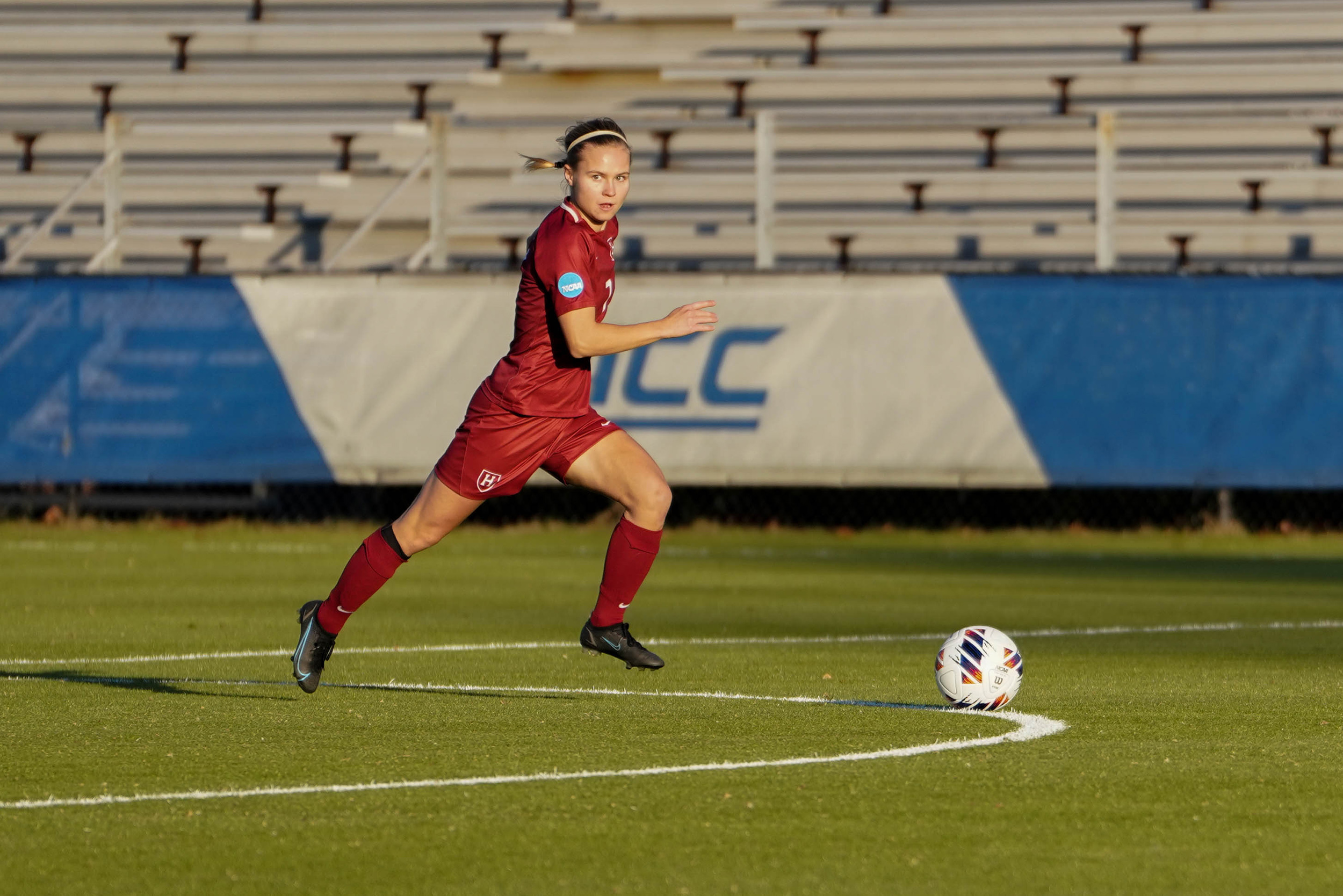 Josefine Hasbo runs on field.