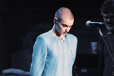 Sinead O’Connor looks down as she is booed onstage.