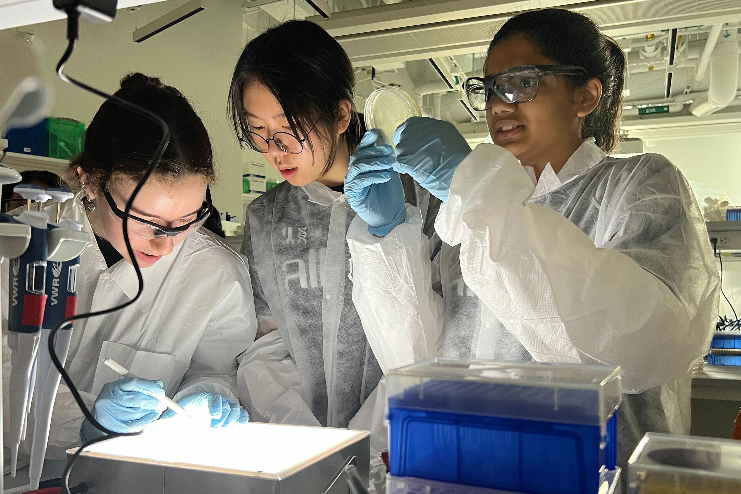 Three students in a lab.