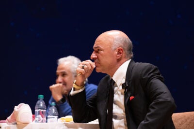 Brandon Chi approaches Kevin O'Leary with a leaf sample.