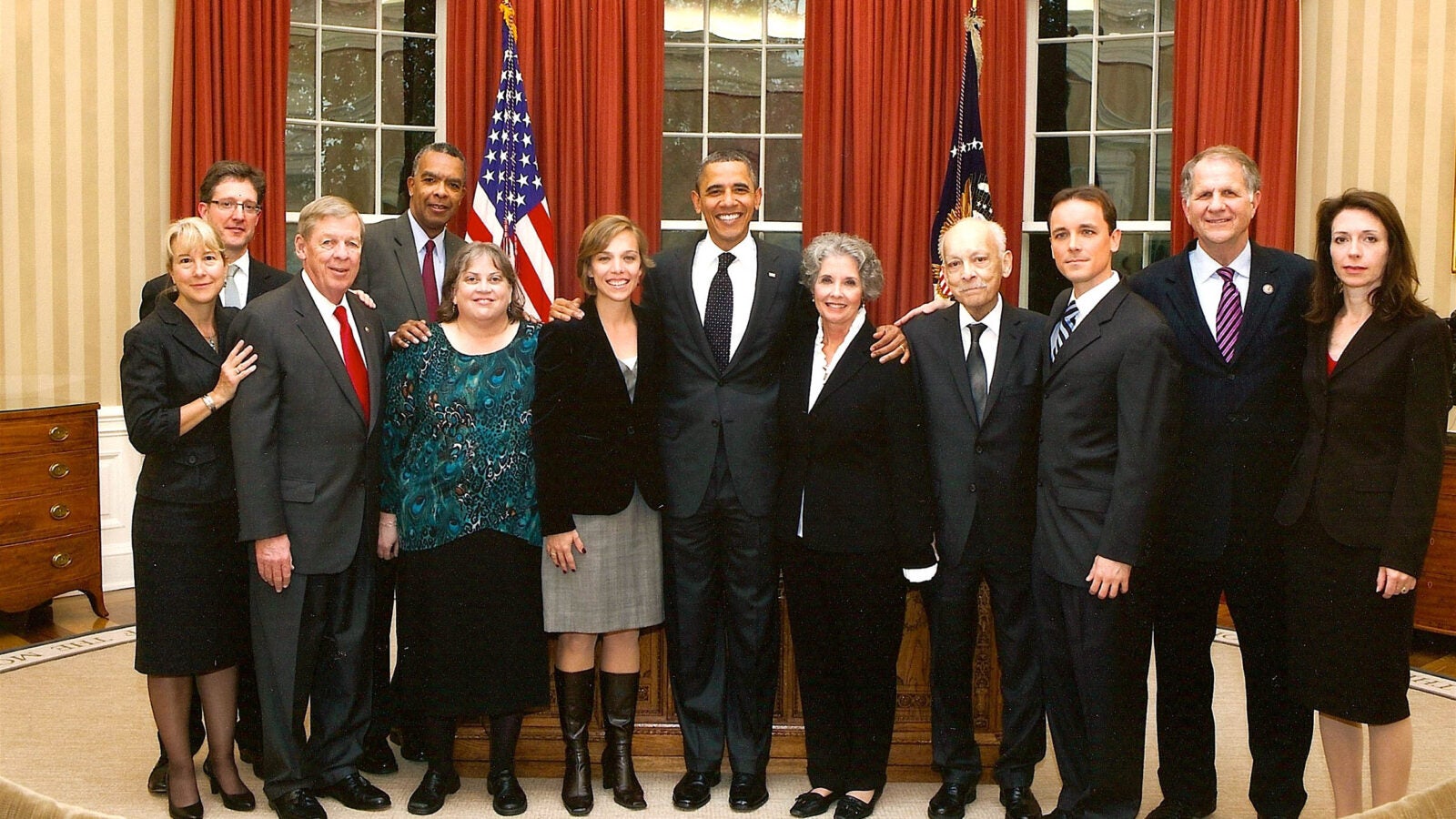 Karestan Koenen in the White House with President Obama and others after passage of Kate Puzey Peace Corps Volunteer Protection Act.