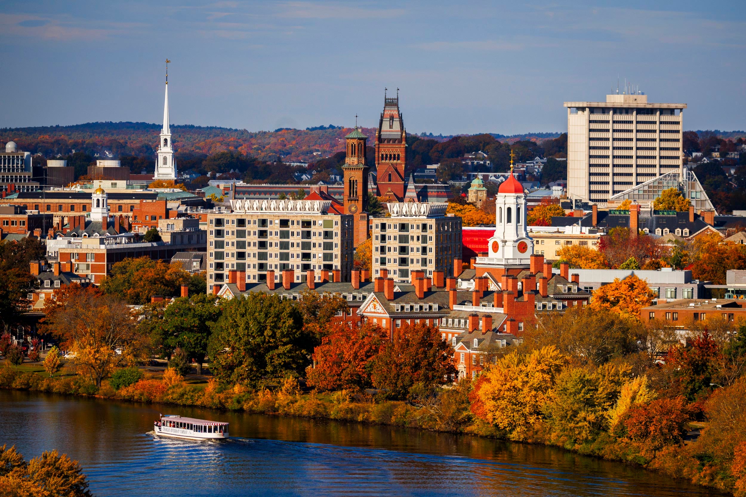 Overview of the Charles River and Harvard campus with fall foliage.