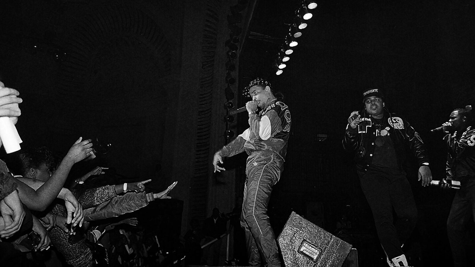 Ice T with microphone on stage in 1989 photo.