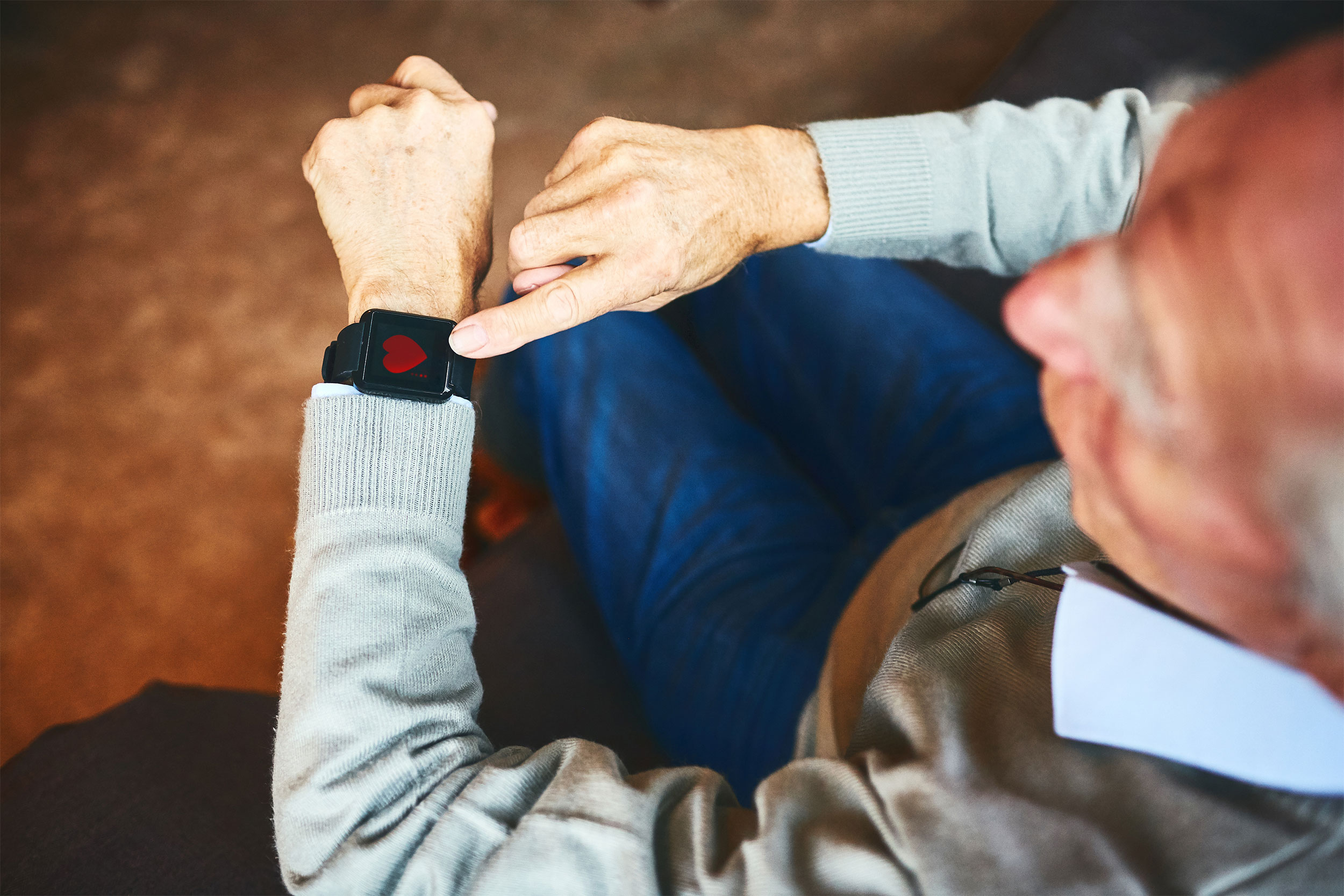 Wearable device used by elderly man.