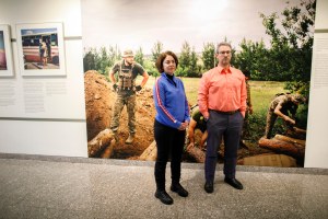 Alexandra Vacroux and Daniel Epsteinstanding in an exhibition called “5K from the Frontline” that features photography by Anastasia Taylor-Lind taken in the region of Donbas of eastern Ukraine.