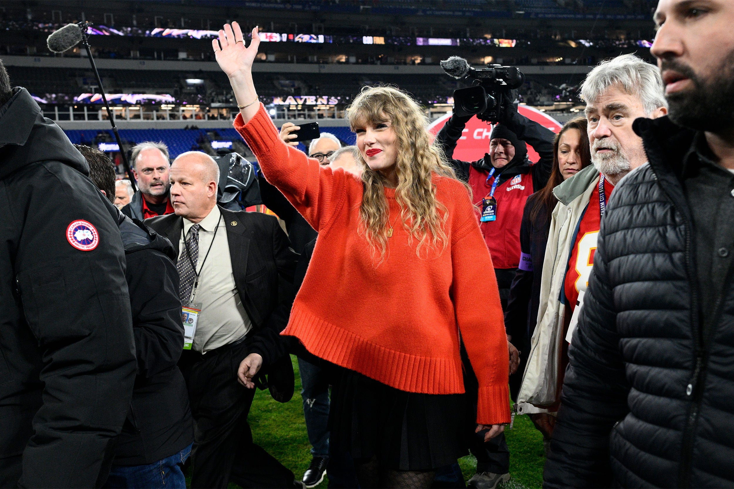 Taylor Swift on football field.