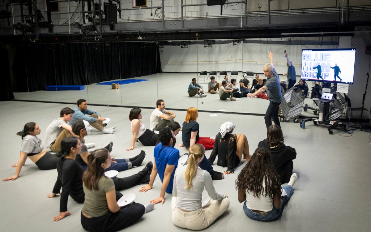 Blue Man Group member Pete Simpson demonstrates movement to students in Harvard physical theater class.