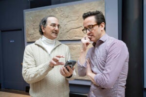Peter der Manuelian (left) and Adam Aja discuss the new AR features