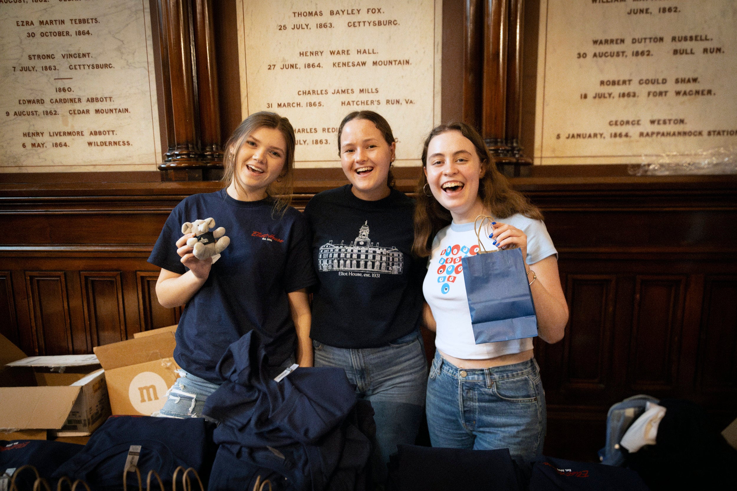 Emily Shrieves ’26 (from left), Helen Scarborough ’25, and Siena Lerner-Gill ’25 pose for a photo as a part of Eliot House.
