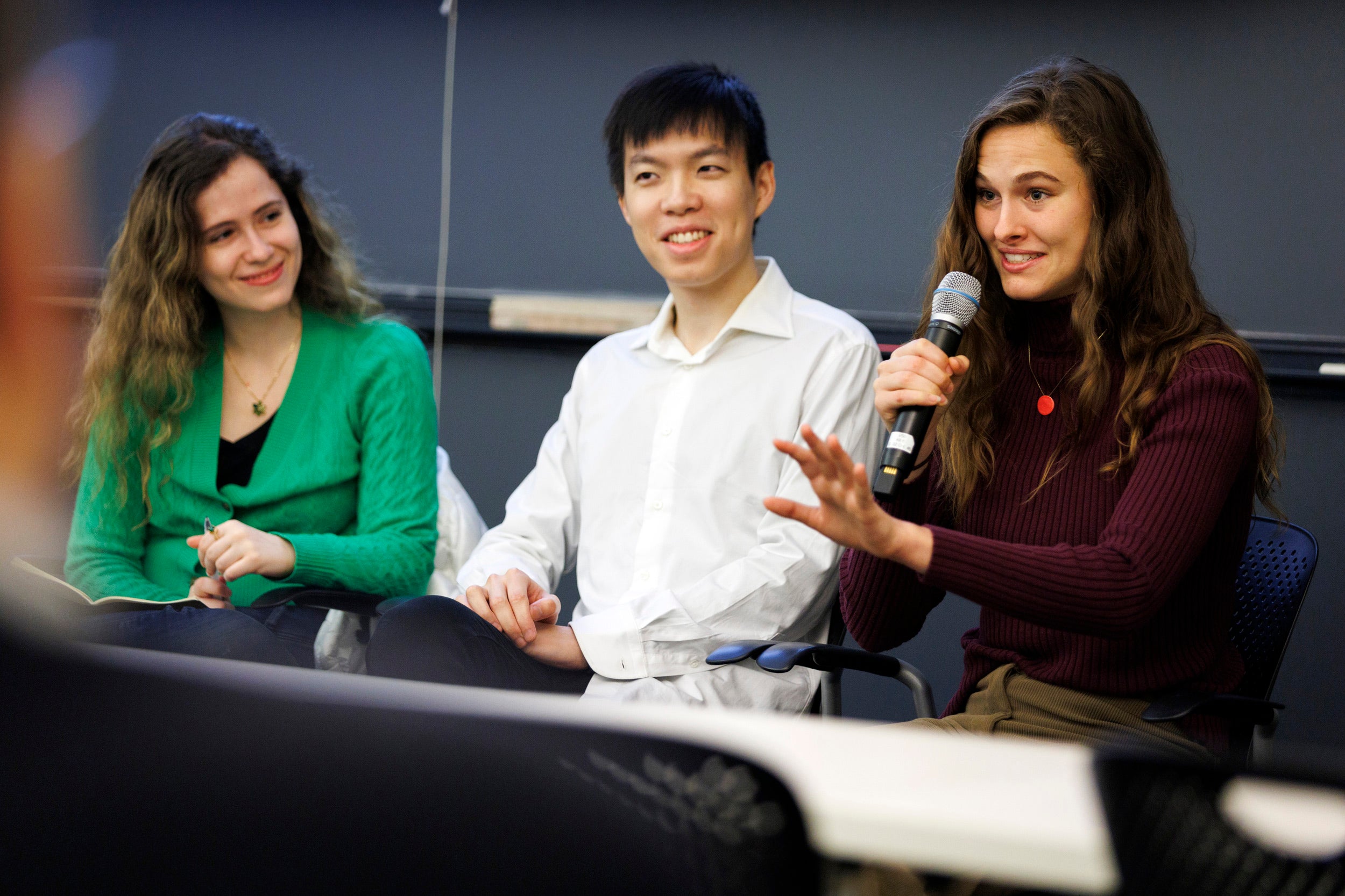 Students Naomi Bashkansky, Fred Heiding, and Chloe Loughridge discuss generative AI at the symposium.