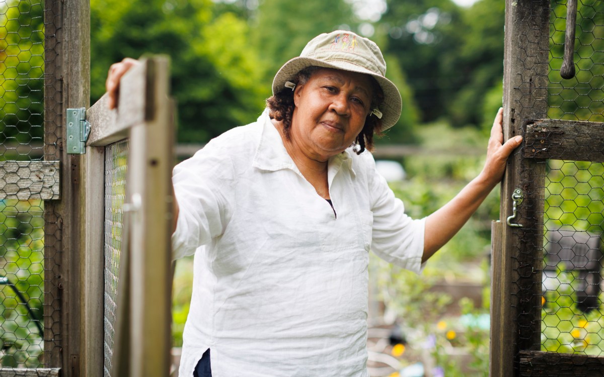 Jamaica Kincaid stands at the entrance to her garden in North Bennington, Vermont.