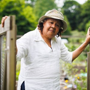 Jamaica Kincaid stands at the entrance to her garden in North Bennington, Vermont.